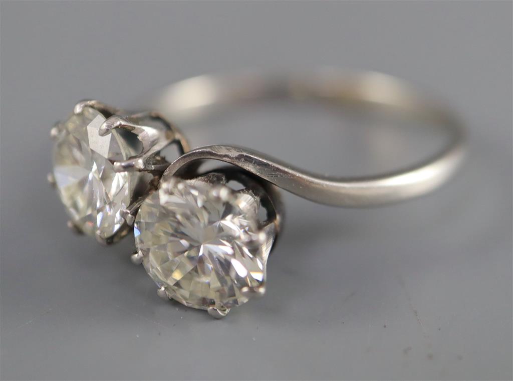 A platinum? and two stone diamond crossover ring,
